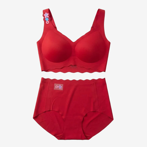 A two-piece red lingerie set consisting of a bralette with scalloped edges and a matching high-waisted brief, laid flat on a white background. The bralette features a small floral applique on the shoulder strap.