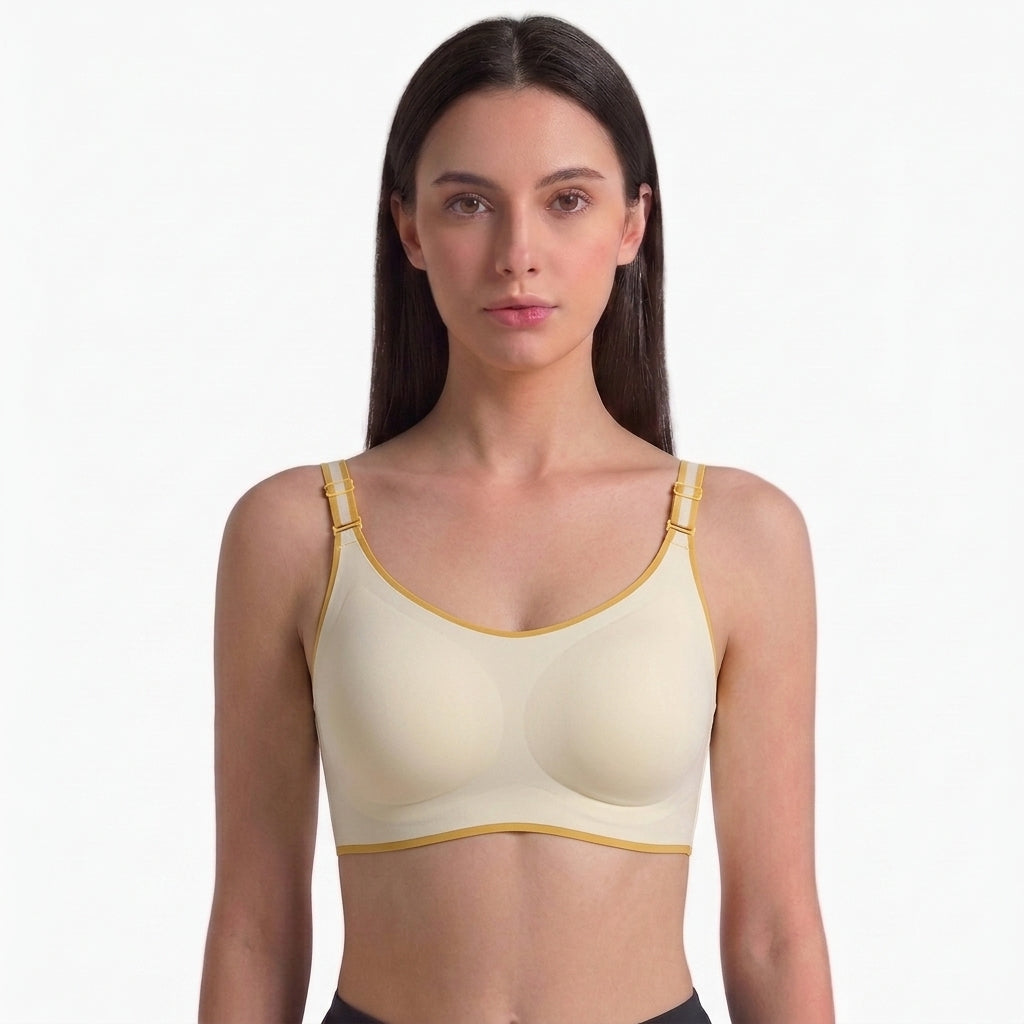 Model wearing Wireless Comfort Bra in cream with gold trim – front view